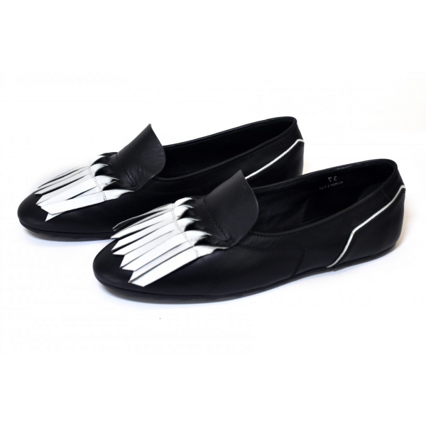 Black slippers with white fringe