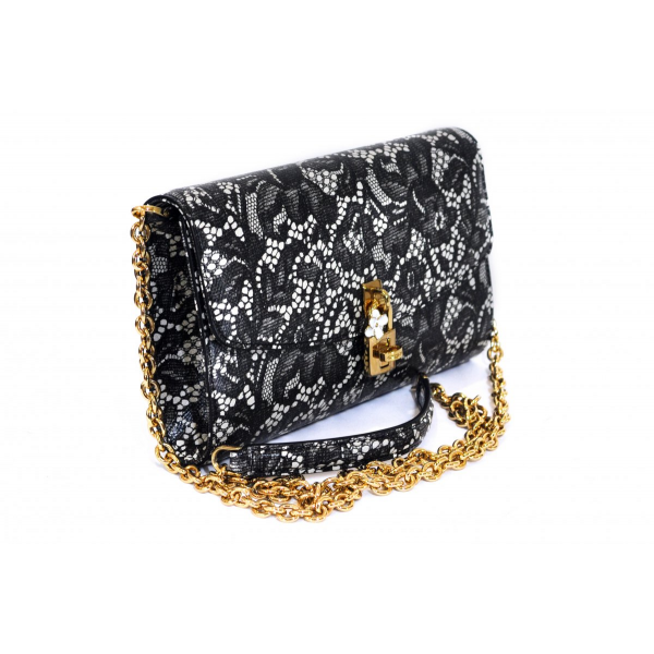 Clutch with lace pattern
